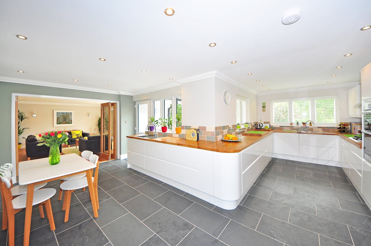 grey floors and white island in kitchen