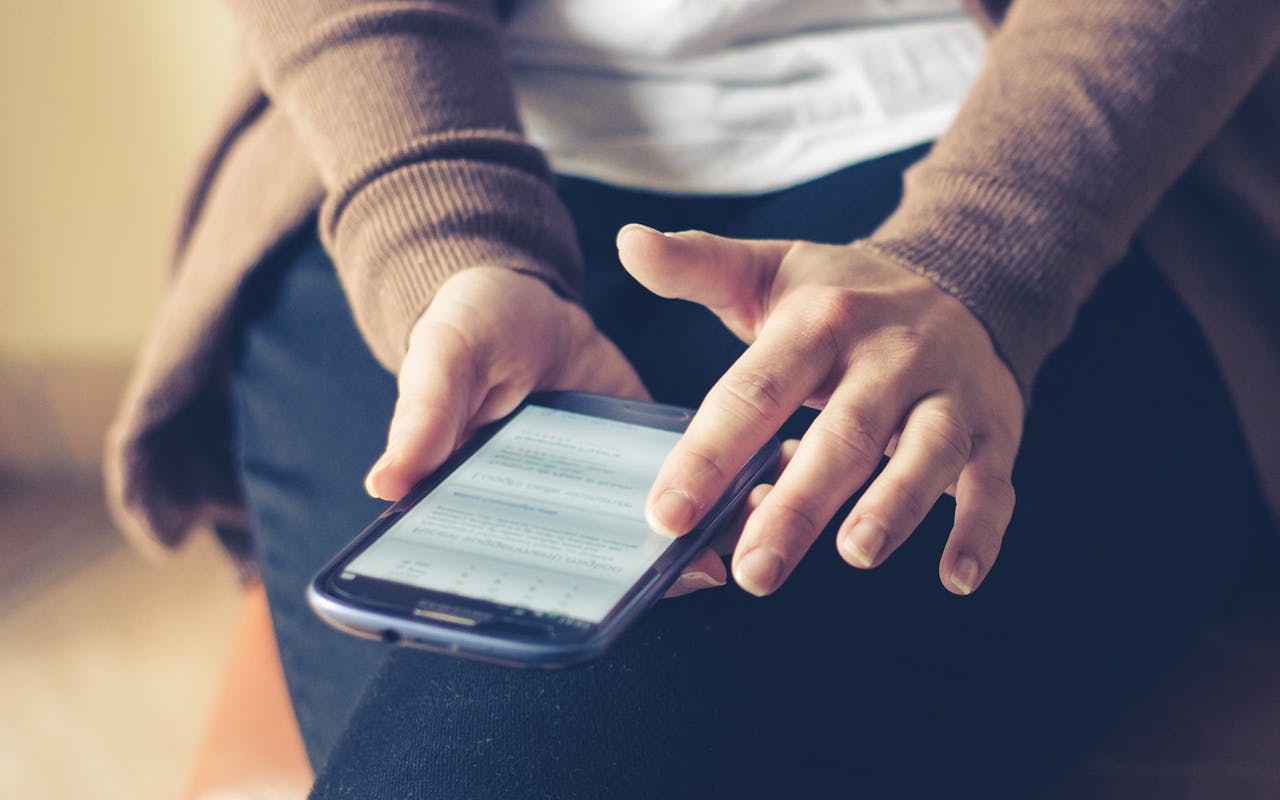person scrolling social media on computer
